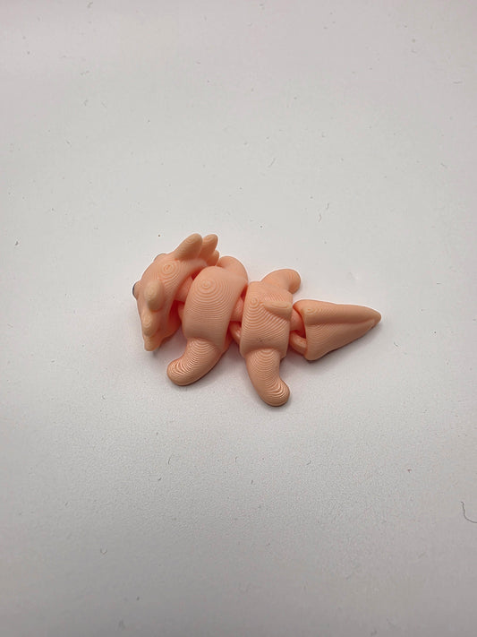 Small peach articulating Axolotl