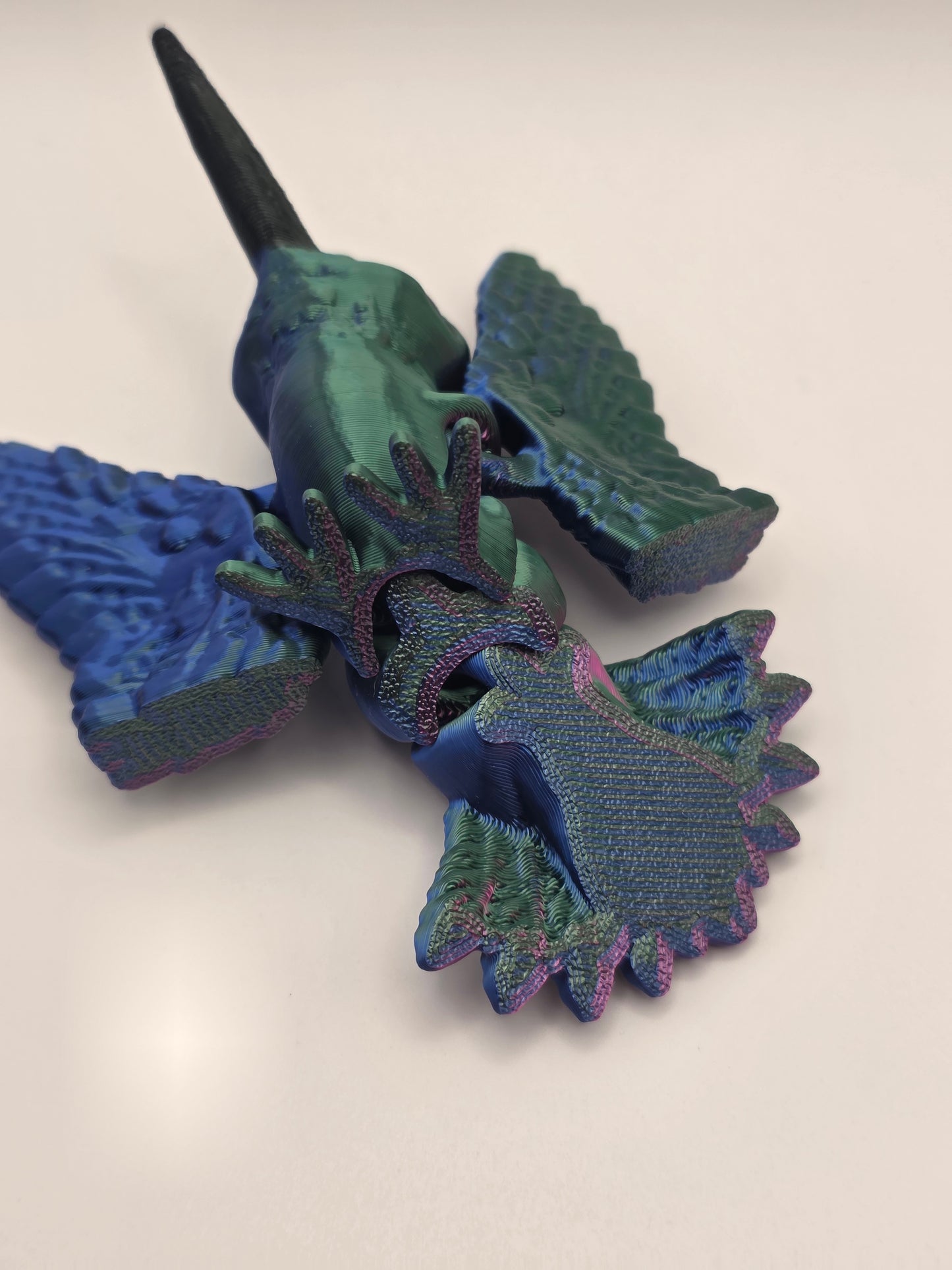 Hummingbird (articulating) vibrant red, green, and blue tri-color.
