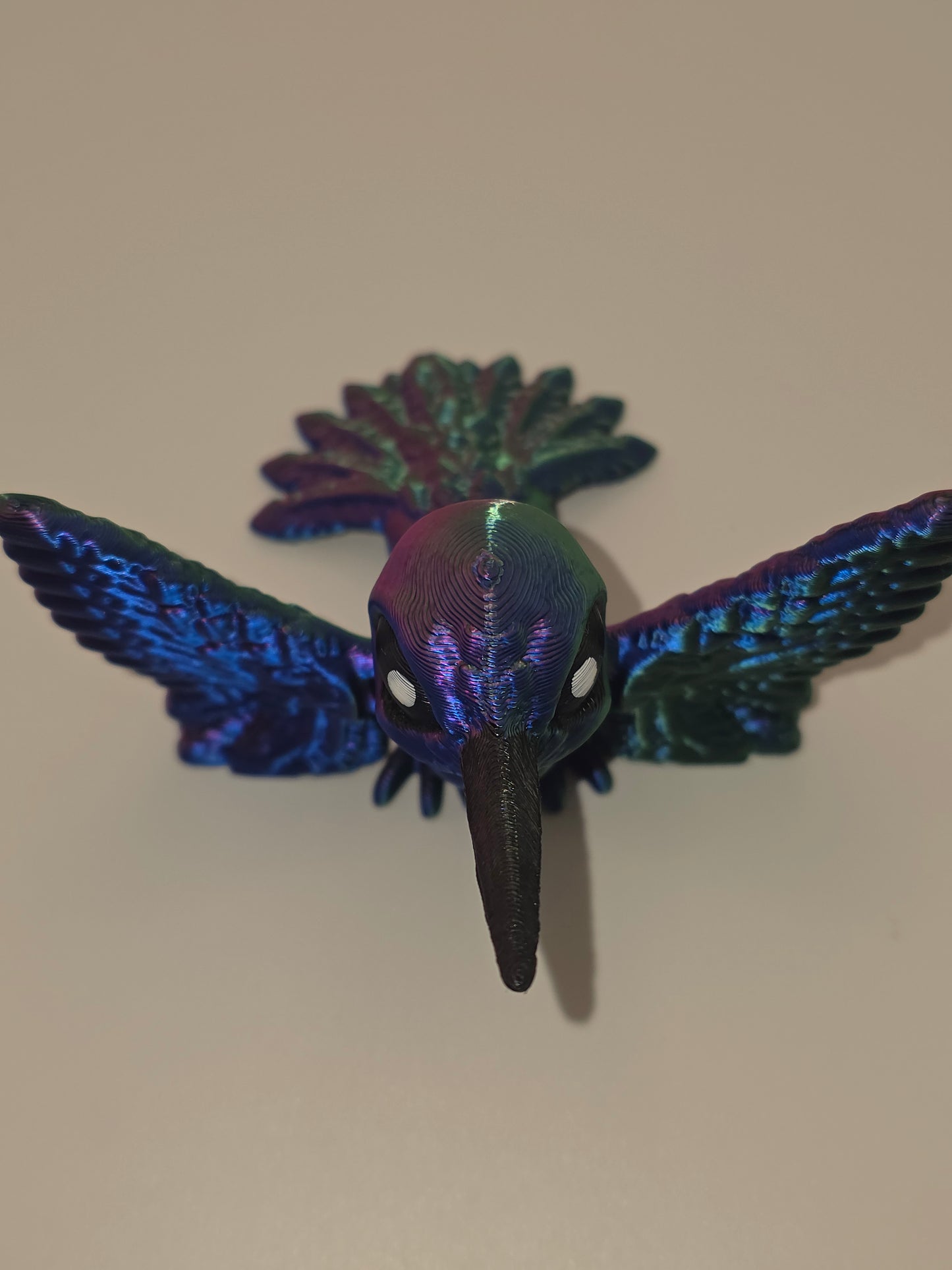 Hummingbird (articulating) vibrant red, green, and blue tri-color.