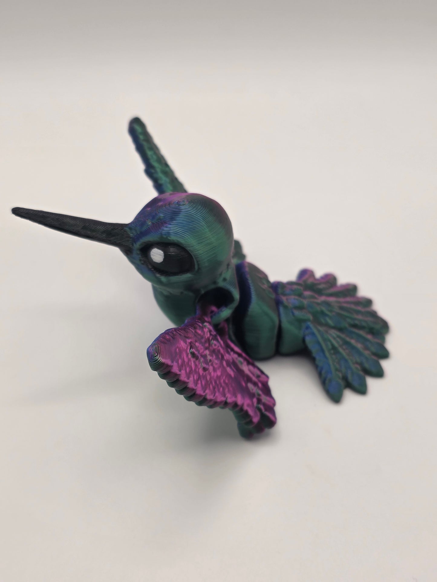 Hummingbird (articulating) vibrant red, green, and blue tri-color.