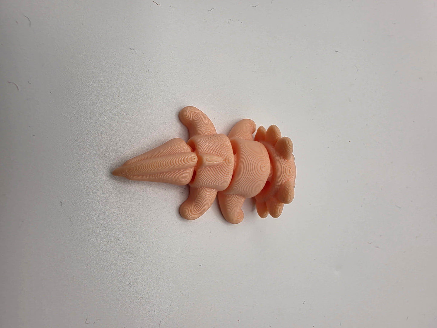 Small peach articulating Axolotl