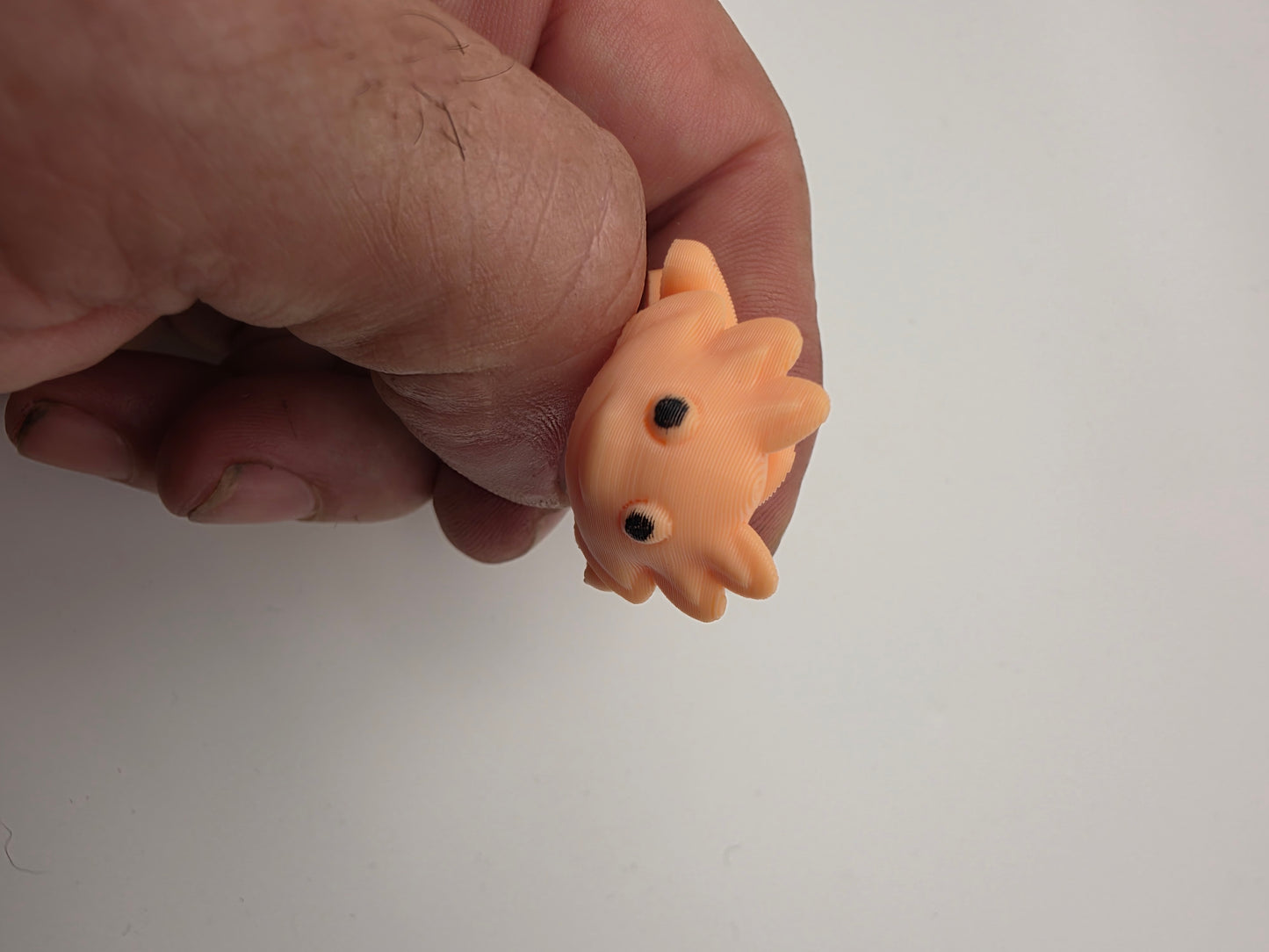 Small peach articulating Axolotl