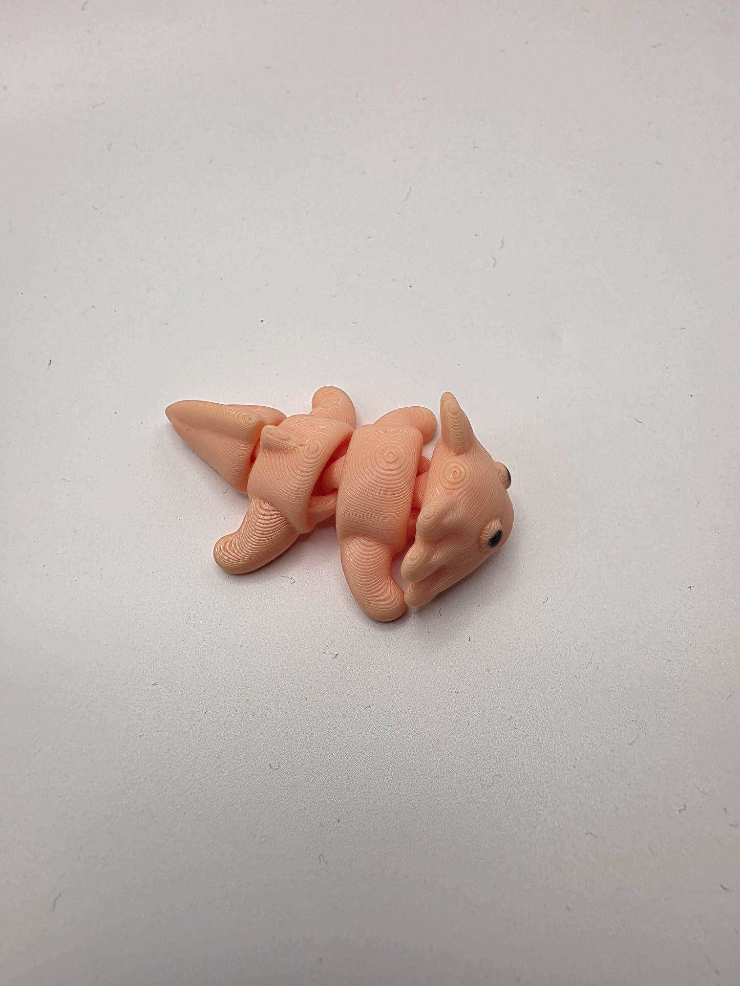 Small peach articulating Axolotl