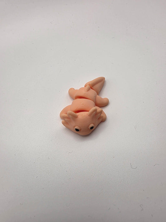 Small peach articulating Axolotl